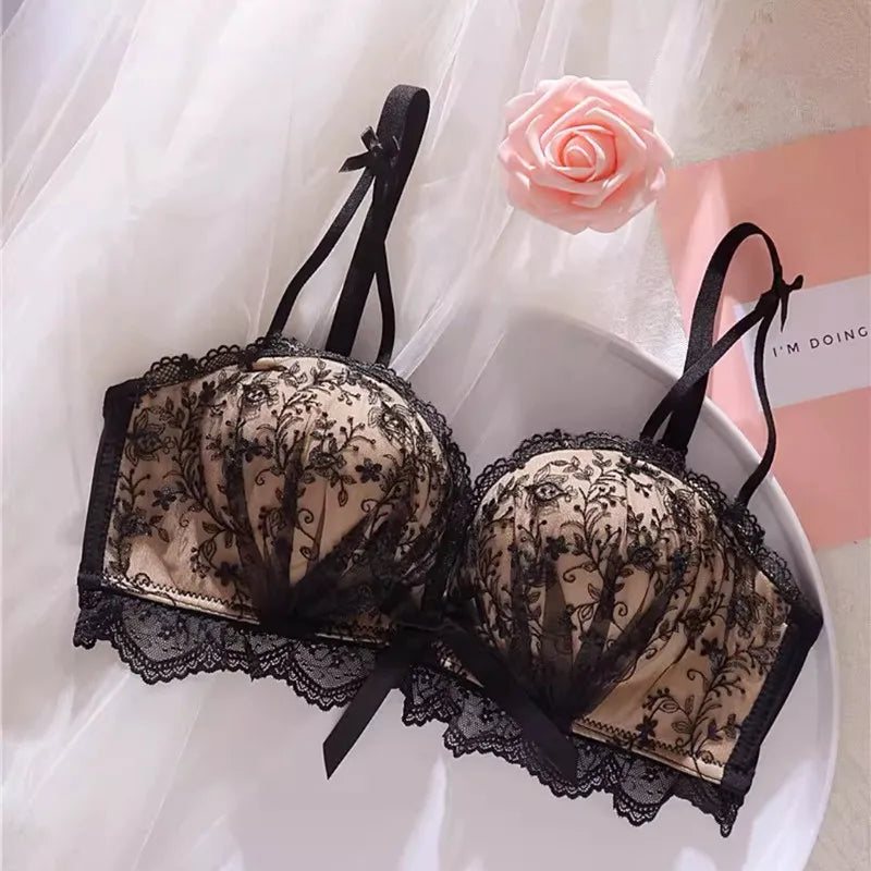 Seamless Strapless Bralette in black with floral lace detailing and a decorative bow