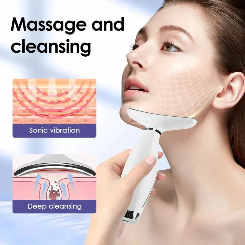 Woman using a handheld facial beauty massager with a curved treatment head along the jawline.
