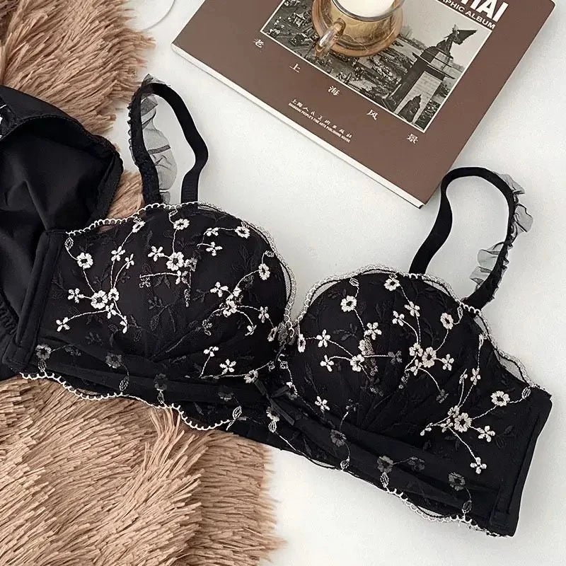 Seamless Strapless Bralette in black shown flat to display its floral lace pattern and design details