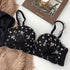 Seamless Strapless Bralette in black shown flat to display its floral lace pattern and design details