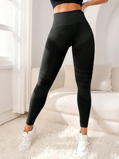 Front view of black high-waisted workout leggings with a full-length fitted design.
