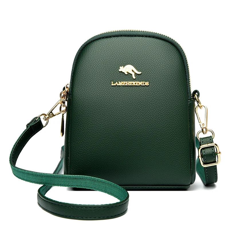 Dark green small zip-up backpack with a top handle and gold-tone hardware.