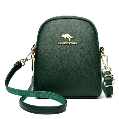 Dark green small zip-up backpack with a top handle and gold-tone hardware.