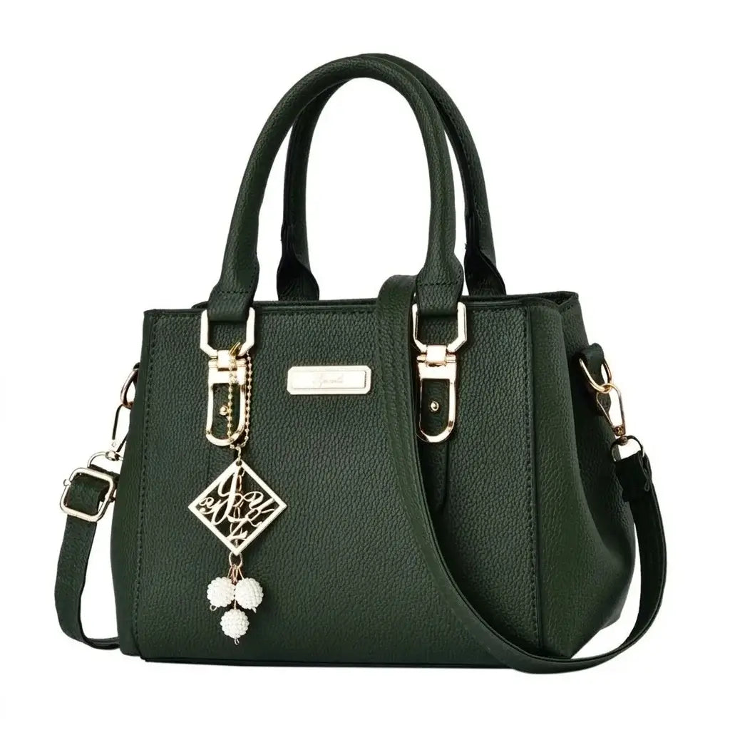 Dark green structured handbag with top handles and gold-tone hardware.