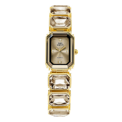 Gold Bracelet Watch for Women Rectangular Dial with a light-colored dial and clear decorative bracelet stones