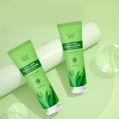 Two green aloe vera exfoliating cream tubes arranged on a light green background.