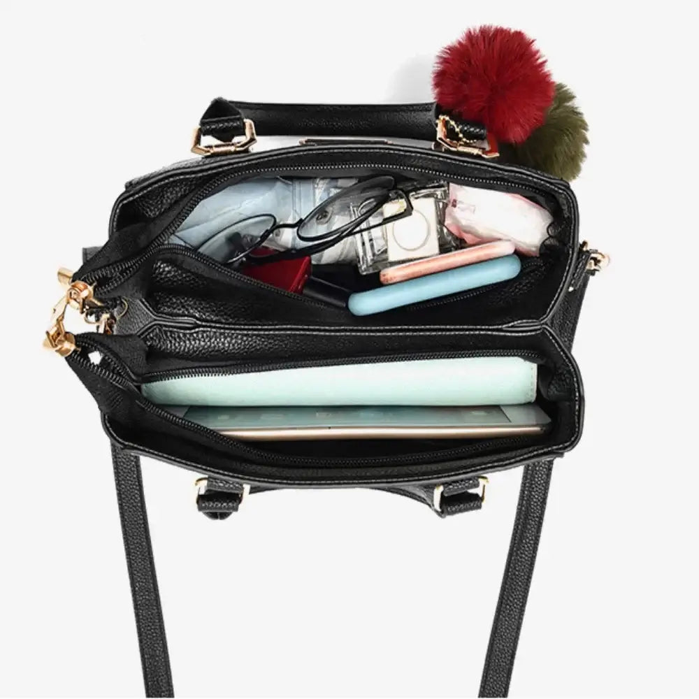 Structured Handbag opened to show its interior compartments and storage space