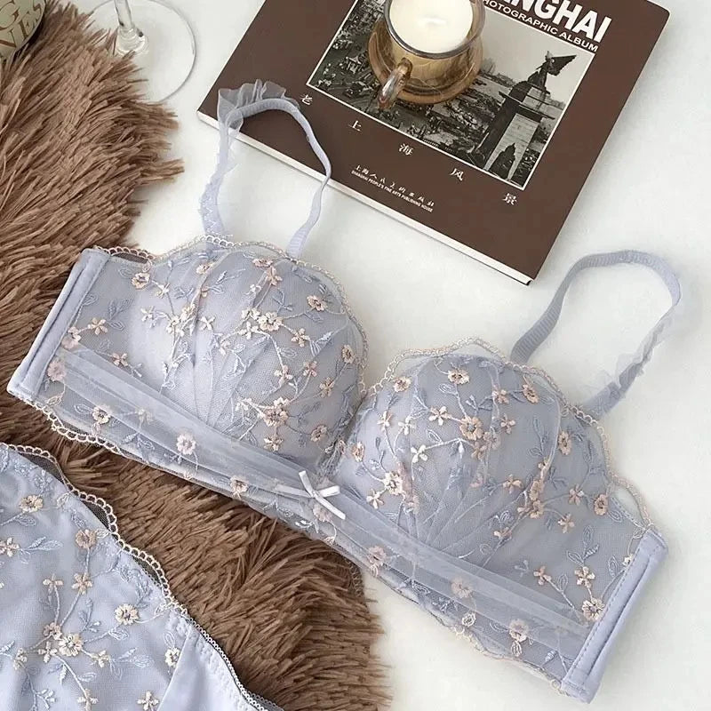 Seamless Strapless Bralette in light blue with floral lace detailing and adjustable shoulder straps, displayed flat on a neutral background