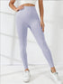 Beige high-waisted workout leggings shown in a side pose with a fitted silhouette.