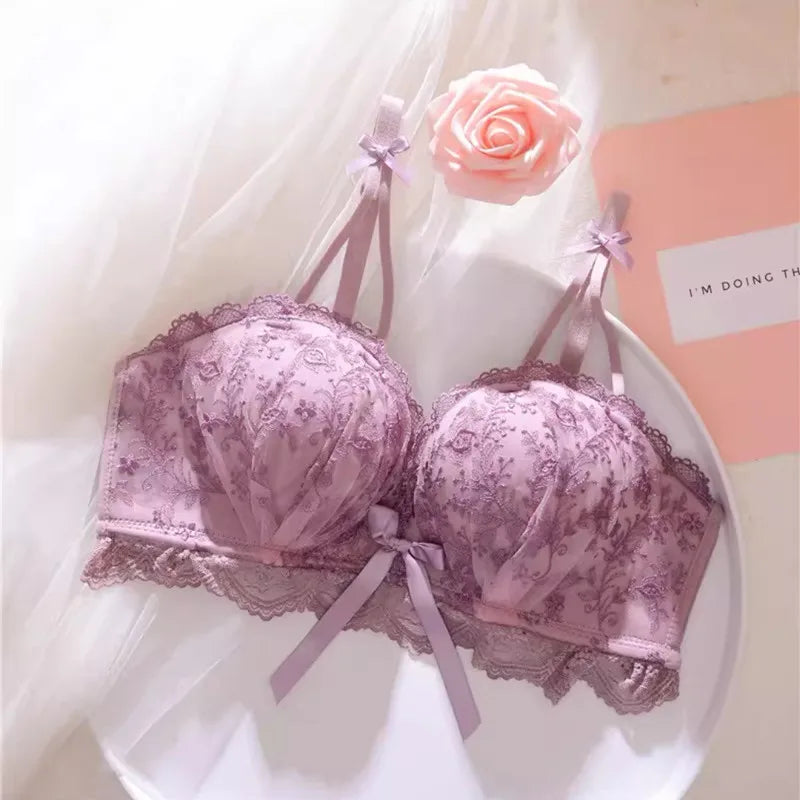 Seamless Strapless Bralette in mauve with lace detailing displayed against a soft pink background
