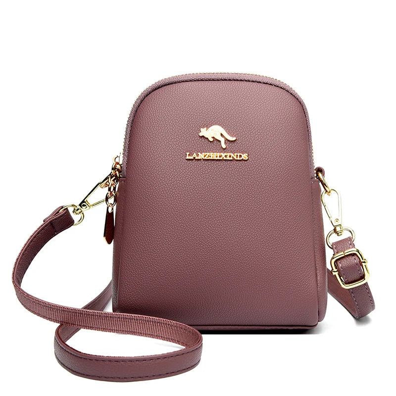 Mauve small zip-up backpack with a top handle and gold-tone hardware.