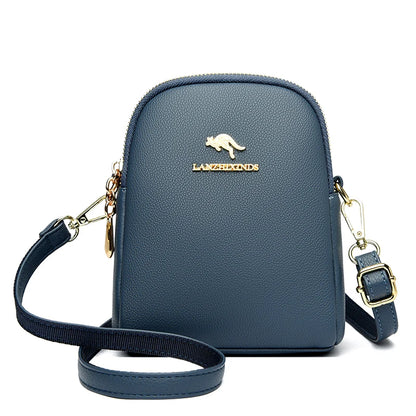 Navy blue small zip-up backpack with a top handle and gold-tone hardware.