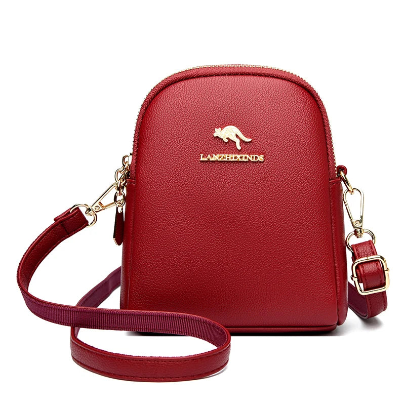 Zip-Up Backpack for Women in red with a top handle, shoulder straps, and gold-tone hardware