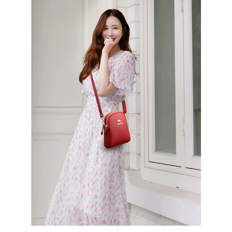 Zip-Up Backpack for Women in red, modeled with a light pink dress and crossbody-style strap